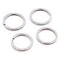 Close-up of four flat silver stainless steel key rings with a spiral metal structure - Standard Small