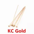 Detail of 7 KC Gold ball head pins for jewelry making shown on a white background - KC Gold