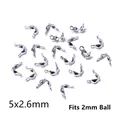 Macro detail of 5x2.6mm stainless steel silver bead tips for 2mm ball chain jewelry making - 5x2.6mm
