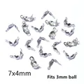 Macro detail of 7x4mm stainless steel fold-over crimp beads for 3mm ball chain jewelry - 7x4mm