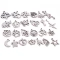Assorted 24-piece stainless steel DIY jewelry pendants including tree and star shapes - Random Mixed Styles (Random Mixed)