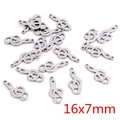 Detailed view of silver treble clef music charms in 16x7mm for jewelry making - Treble Clef Style / 16x7mm