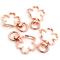 Set of four rose gold cherry blossom shaped lobster clasps with rotating ring base - Cherry Blossom / Rose Gold