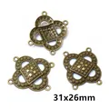 Macro detail of antique bronze floral jewelry connectors in 31x26mm size for DIY crafts - Hollow Cross Floral Style (AI1-07)