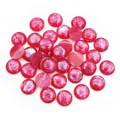 Macro shot of 12mm round bright pink resin cabochons with sparkling glitter texture - Dark Red