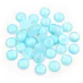 Close-up of sky blue 12mm round resin cabochons with sparkling glitter texture for DIY crafts - Light Green