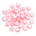 Macro detail of 12mm pink resin flatback cabochons with pearl luster for DIY jewelry making - Pink