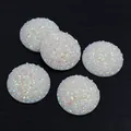 White holographic round resin cabochons with sparkling glitter and textured surface - AB White