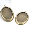 Two vintage bronze oval alloy pendant bases for DIY jewelry making with matte finish - Bronze
