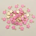 Detail view of pink enamel flower charms with gold edges for DIY jewelry making - Pink Flower (E1-21)