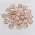 Detailed macro view of 12mm champagne gold round resin rhinestones with faceted texture - Champagne Gold (G7-26)