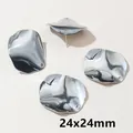 Close-up of 24x24mm silver irregular wavy round earring studs with DIY hanging loops - Steel Disc Style (V1-45)