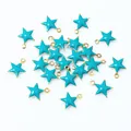 Detailed view of small star-shaped stainless steel charms with blue enamel finish - Lake Blue