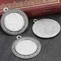 Three antique silver 25mm cabochon pendant settings with elegant scrolled edges - A3-52
