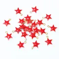 Macro shot of 8.5x7mm red enamel star charms with gold trim for DIY jewelry making - Red