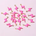 Macro shot of 20 pink enamel lightning bolt charms with gold trim for DIY jewelry - Bright Pink (E2-101)