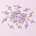 Macro detail of 20 lightning bolt enamel charms for DIY jewelry making in purple and gold - Light Purple (E2-102)