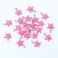 Detail showing neon pink star pendants with gold trim and top loops for DIY jewelry - Rose Red