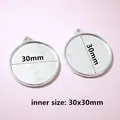 Close-up of a 30mm round silver alloy pendant base with 30x30mm inner size for DIY jewelry - C7-31 Round Metal Pendant Tray (30x30mm)