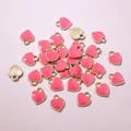 Detailed close-up of pink heart enamel charms with gold-plated edges for DIY jewelry - Rose Red