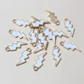 Macro detail of lightning bolt alloy pendants with white enamel for DIY jewelry making - White