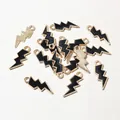 Macro detail of lightning bolt charms with black enamel and gold alloy finish for DIY jewelry - Black