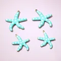 Golden starfish pendant with light blue enamel and white polka dots for jewelry DIY - 22.5x20mm / Green