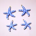 Set of four blue starfish charms with white dots and gold plating for DIY jewelry - 22.5x20mm / Blue
