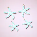 Set of four blue polka dot white enamel starfish pendants with gold plated edges - 22.5x20mm / White