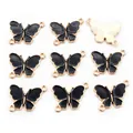 Set de nueve colgantes de mariposa negros y dorados con dos anillas para bisutería - Paquete de 10 / Negro