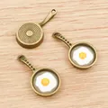 Alloy fried egg pan charms in bronze finish for DIY necklace and bracelet crafting - Bronze