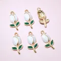 Detailed view of six DIY gold tulip charms with white enamel petals and green leaves - Pure White Style (AI6-33)