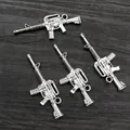 Set of four vintage silver alloy machine gun pendants for DIY jewelry and keychains - Modern Assault Rifle Style (AC3-33)