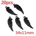 Set mit 20 schwarzen Legierungsflügeln für DIY-Schmuck, 34x11 mm für Halsketten - Flügel