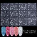 Macro shot of silver 3D snowflake nail stickers with festive deer and star patterns - TY091-102 Snowflakes Theme / Silver