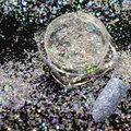 Macro shot of holographic silver nail art flakes with iridescent laser reflection effect - Aurora Holographic Style (ALS-12)