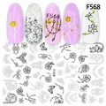 Detail showing F568 nail stickers with black floral patterns and application on nails - Rose Butterfly Mandala Style (F568)