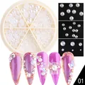 Macro detail of mixed-size white flatback pearls in a six-grid nail art jewelry carousel - Semicircle Pearl
