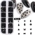 Macro detail of 12-grid box with various black nail art charms like stars and moons - 12-Grid Black Special-Shaped Rhinestones (1897-Black)