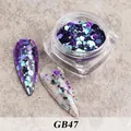 Macro view of GB47 iridescent hexagonal nail sequins in a jar with sample nail tips - Bottled Sequins Gb47