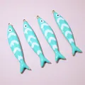 Detailed macro view of four mint green enamel fish charms with gold-plated metal edges - Mint Green Style (E6-72)