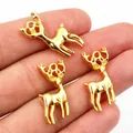 Trois breloques élan dorées pour bijoux, pendentifs renne en métal sur le bout des doigts - Or