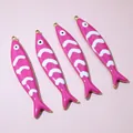 Macro detail of four pink enamel fish pendants with golden edges and scale patterns - Pink Style (E6-73)