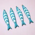 Detailed close-up view of four blue enamel fish pendants for DIY jewelry making crafts - Cyan Style (E6-74)