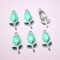 Detailed macro view of 6 pieces green tulip flower enamel charms for DIY jewelry making - Pale Green