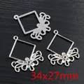 Macro shot of vintage silver alloy floral pendant connectors showing 34x27mm dimensions - Square Frame Floral Scroll Style (Q5-34)