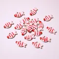 Macro detail of gold-plated fish charms with pink enamel and red stripes for DIY jewelry - Pink Striped Fish (E6-60)