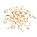 Macro shot of multiple vintage gold heart key charms for DIY jewelry making - KC Gold