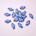 Macro view of blue fish pendants with enamel detailing for DIY jewelry making - Blue Striped Fish (E6-61)