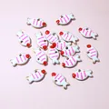 Macro shot of 10x6mm gold-plated stainless steel fish charms with colorful oil drip enamel - White Striped Fish (E6-62)